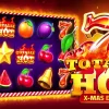 Totally Hot Slot BGaming: ¡La Tragamonedas Festiva con Wilds Expansivos y Alto RTP del 97.21%